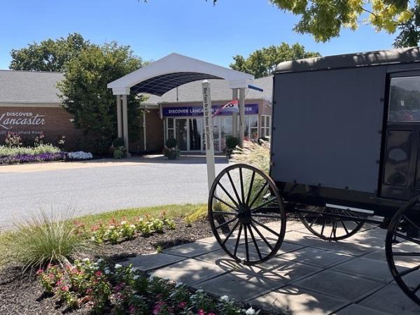 Photo opportunity with a buggy in front of Discover Lancaster Visitors